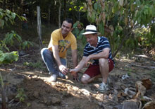 Eric Grandchamp and Duda plant a seedling